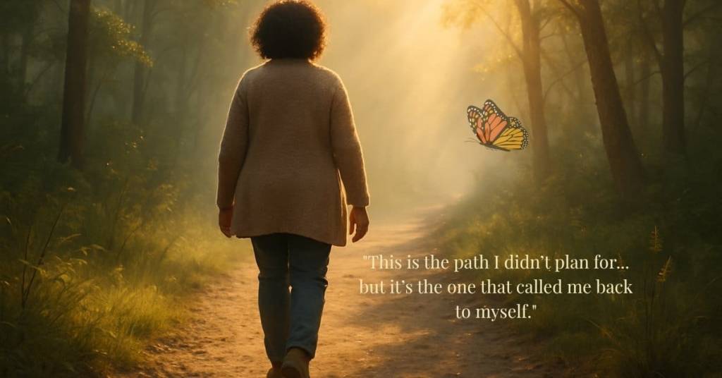 A woman in her 40s walks alone down a glowing forest path at sunrise, surrounded by soft mist and golden light. A monarch butterfly floats nearby, symbolizing transformation and inner return — a visual reflection of the LetyWoven journey.